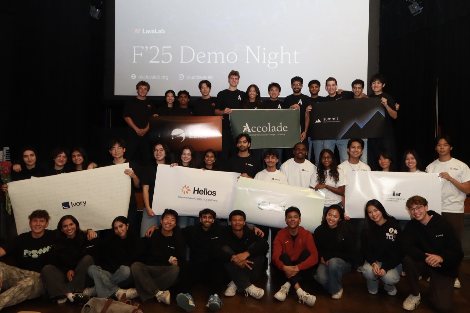 The full LavaLab F'25 cohort gathered on stage at Demo Night.